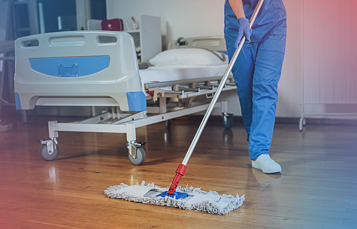 A May's legacy employee performing cleaning activities in a medical environment